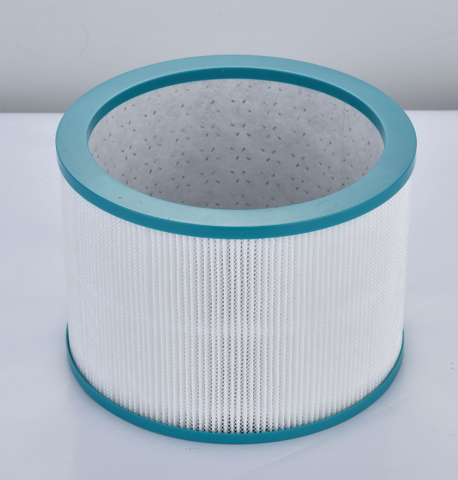 Cylindrical H13 replacement filter with turquoise rims for the UML family